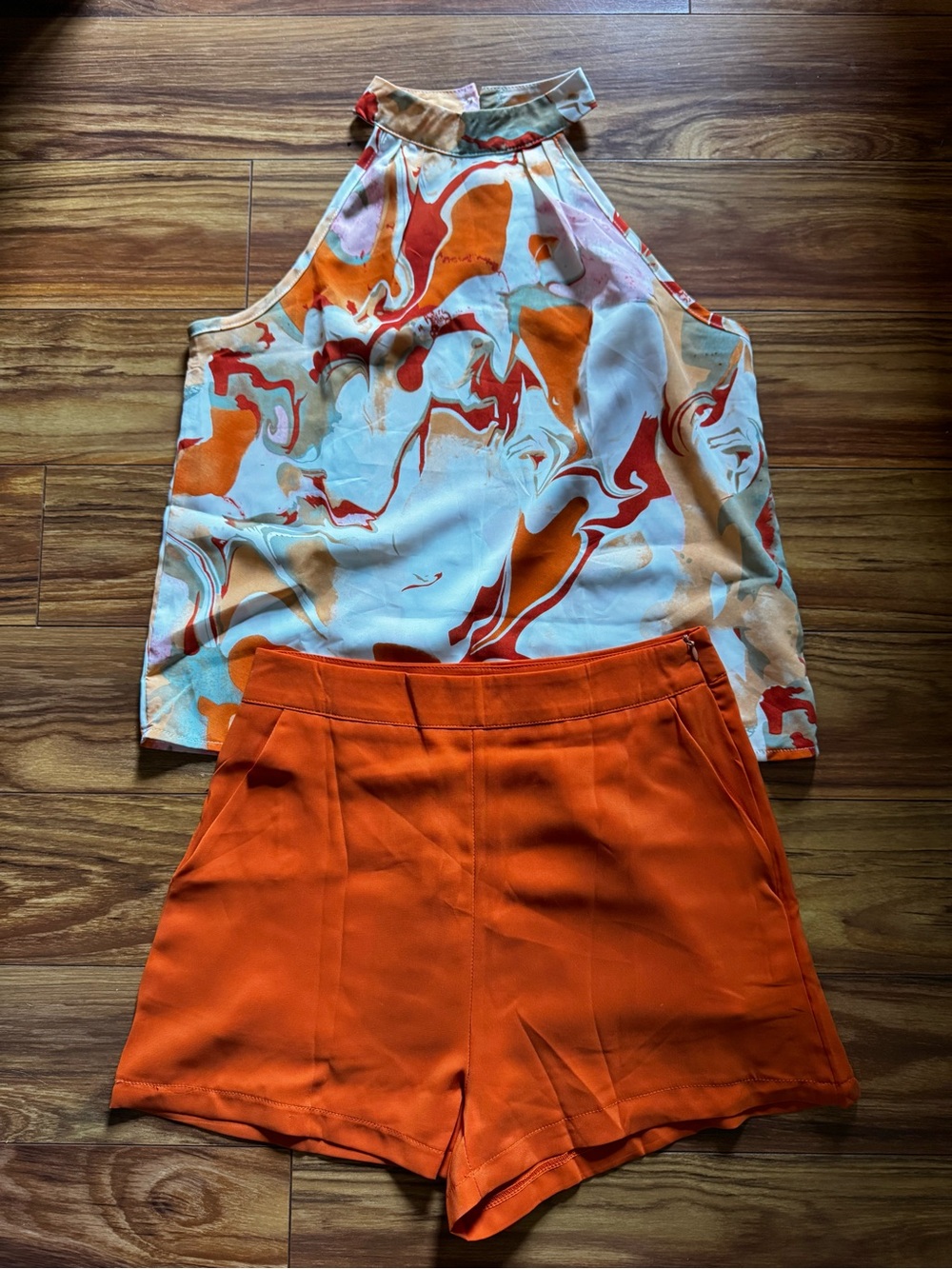 Amazon Orange High-Rise Shorts with Multicolor Swirl Halter Top